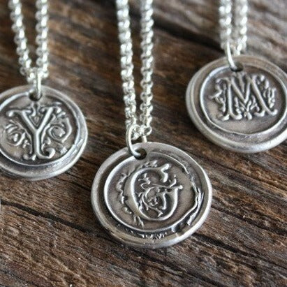 silver wax seal pendant on chain